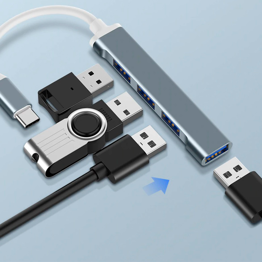 Imagen de un adaptador hub tipo C a USB 3.0 con 4 puertos, que es compatible con una variedad de dispositivos. rayoshop