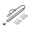 Un hub EON gris de aluminio con conexión USB-C y USB-A muestra siete puertos USB 3.0 azules, junto a un adaptador USB compacto y piezas blancas.