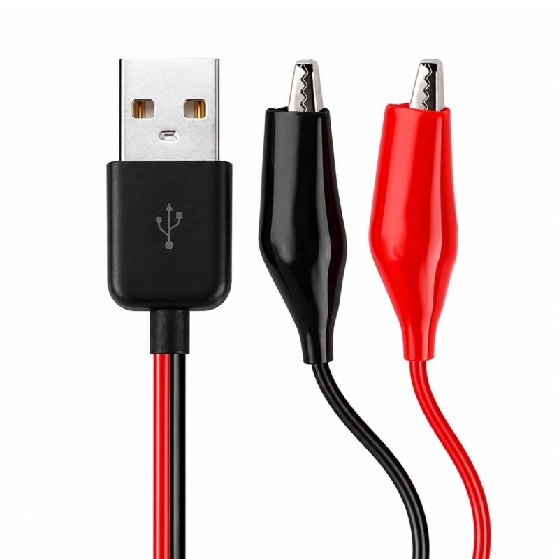 Un cable USB a pinzas cocodrilo muestra conectores rojo y negro junto a un conector USB tipo A, pensado para pruebas eléctricas y alimentación DC.